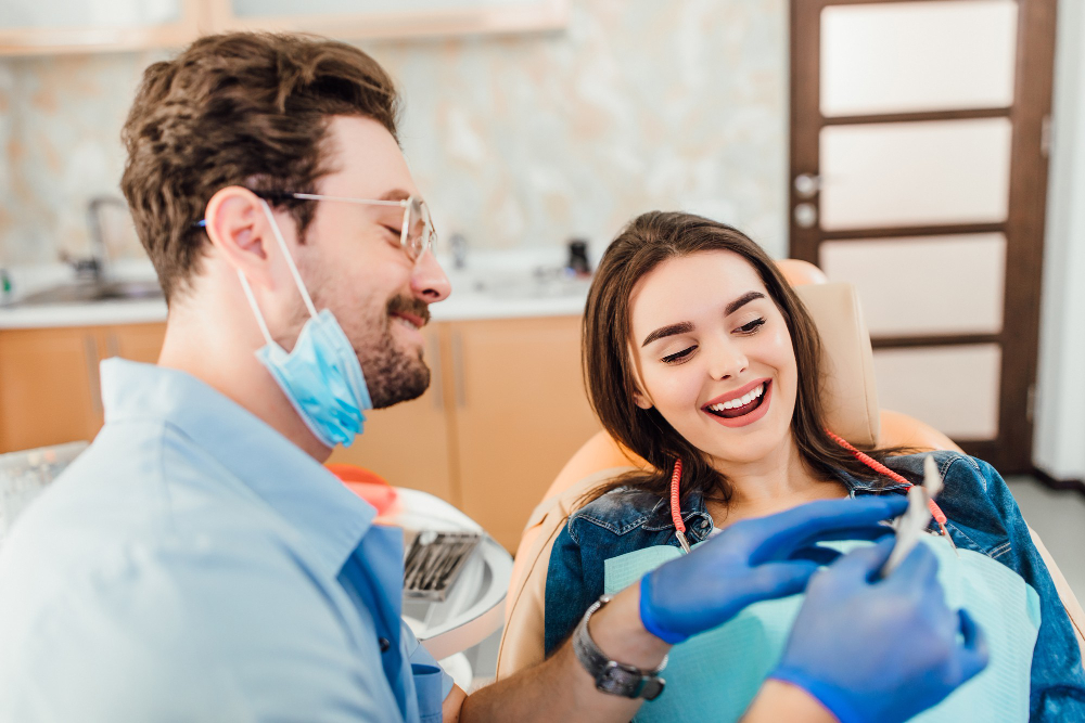 Dentist Matching Colour Tooth Enamel With Whitening Chart